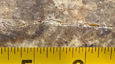 This image provides a closer look at the damage. Photo