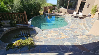 This gorgeous flagstone pool and patio area needed a little professional attention. Photo