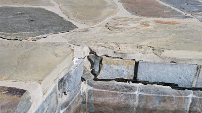 The pool coping was badly damaged in one area. Photo