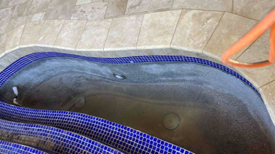 This AFTER image shows the repaired travertine and fountain interior. Photo