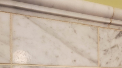 Here is another BEFORE image of the marble shower walls. Photo