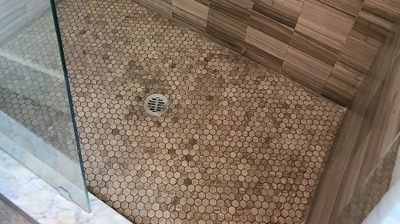 This AFTER image shows the cleaned and restored shower floor. Photo