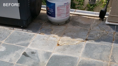 This slate was damaged with calcium water deposits, also known as limescale. Photo