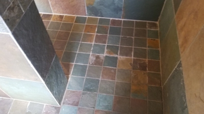Here is another BEFORE image. The slate floor had a dull, dirty appearance. Photo