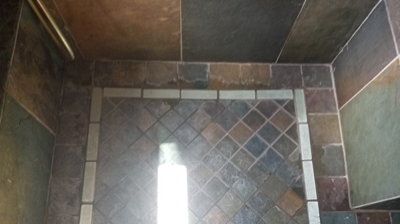 Notice the white calcium build up on the slate in this BEFORE image. Photo