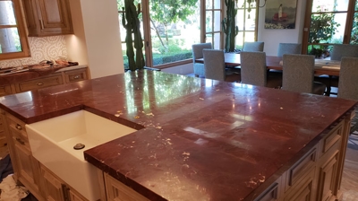 You can see the dullness and damage on this marble island top. Photo