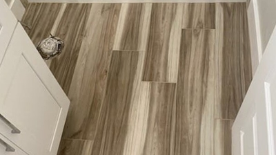 Here is an AFTER image showing the bathroom floor tiles. Photo