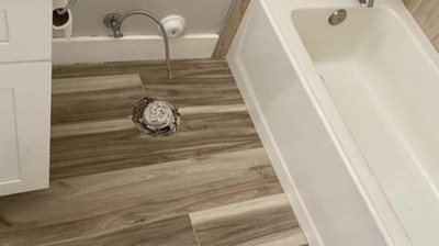 Here is an AFTER image showing the new floor tiles in the second bathroom. Photo