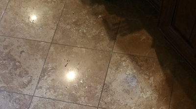 Here is the same section of the floor with the travertine damage repaired. Photo