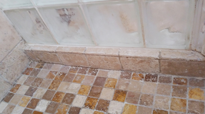 Here is a close up of the travertine shower pan after cleaning and restoration. Photo