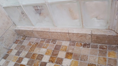 Here is a close up of the travertine shower pan after cleaning and restoration. Photo