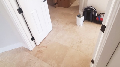 This is a BEFORE image of the dull-looking travertine hallway. Photo