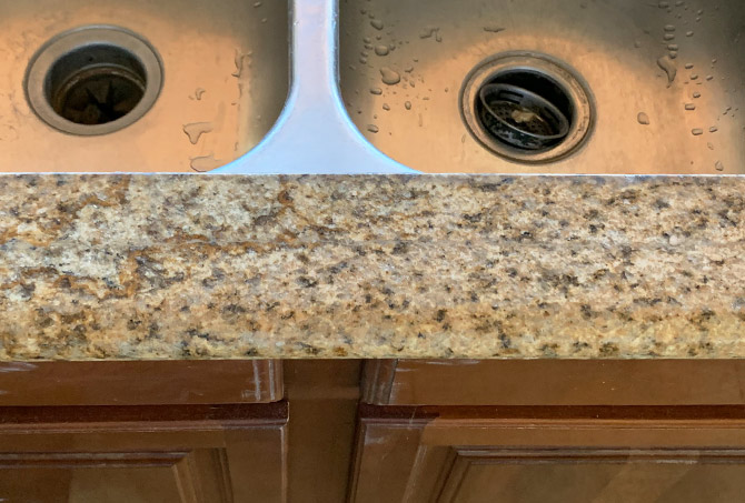 This AFTER image shows the repaired and refinished granite.