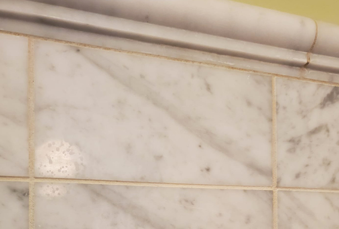Unsightly marble shower tiles.