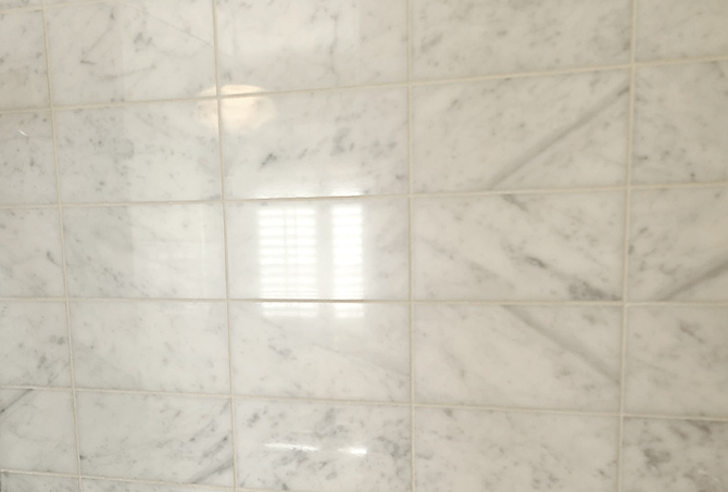 Marble shower tiles restored to like new.