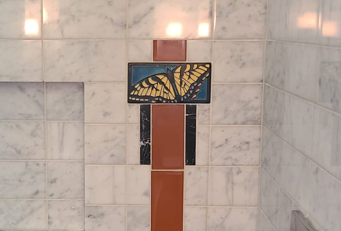 Decorative butterfly glazed ceramic tile inlay.