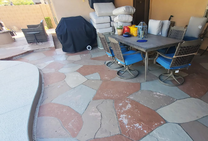 The painted flagstone patio is peeling.
