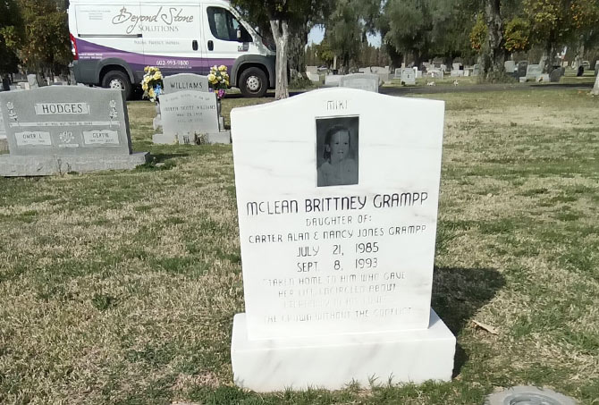 Here is a marble headstone with unsightly calcium buildup.
