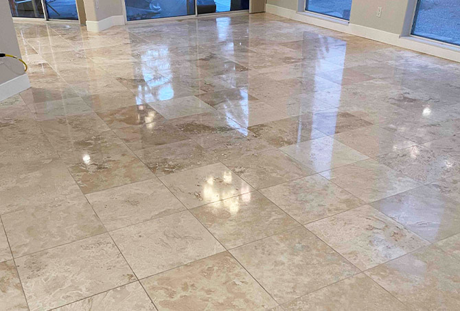 The reflection of the polished travertine demonstrates the difference our services make.