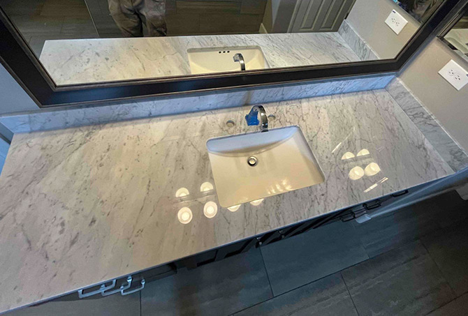 This AFTER image shows the like-new finish of the marble around the sink.