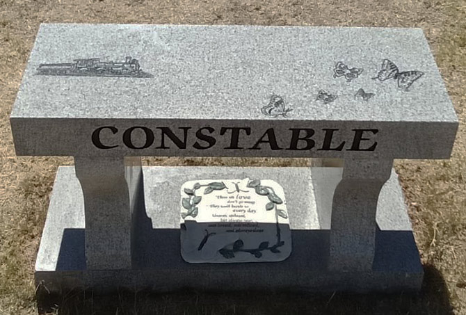 The stains on a granite memorial bench have been removed.