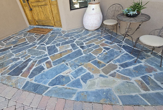This little seating area is so inviting AFTER our flagstone restoration services.