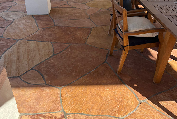 This AFTER image shows the beautiful flagstone in the outdoor dining area.