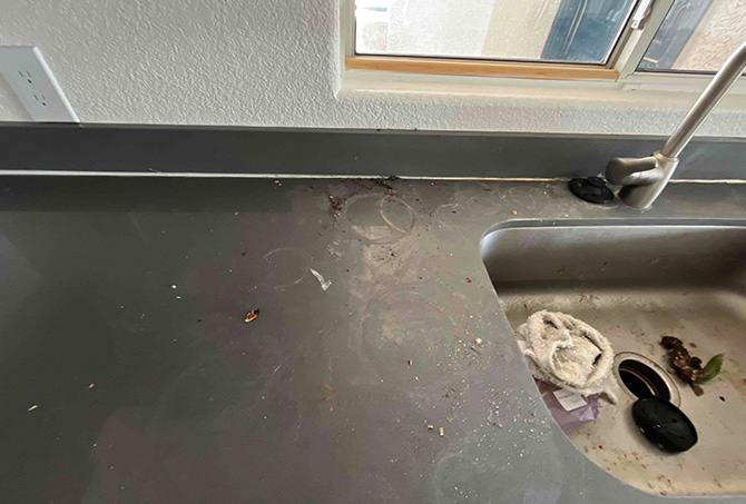This area next to the sink had a lot of surface damage, as you can see in this BEFORE image.