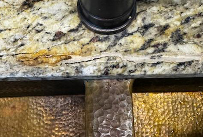 Here is a close look at the granite crack next to the faucet.