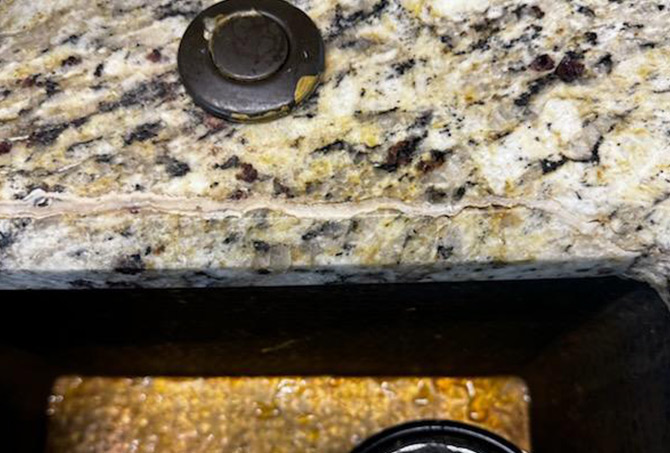 Notice how the homeowner filled the crack with epoxy purchased at a home store.